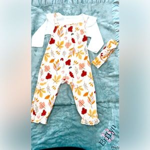 Cream infant one piece jumper with off white shirt to wear underneath.